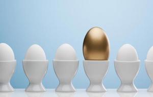 Golden egg in egg cup